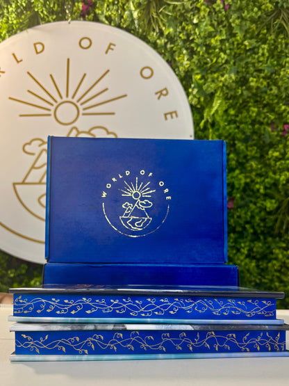 Blue decorative item with 'World of Ore' logo against a green background