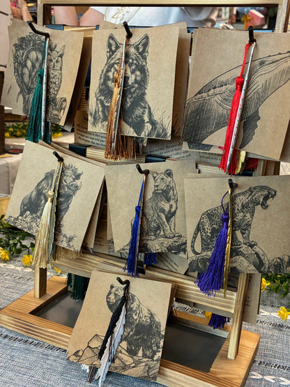 Collection of bookmarks with illustrations and decorative elements on a textured surface