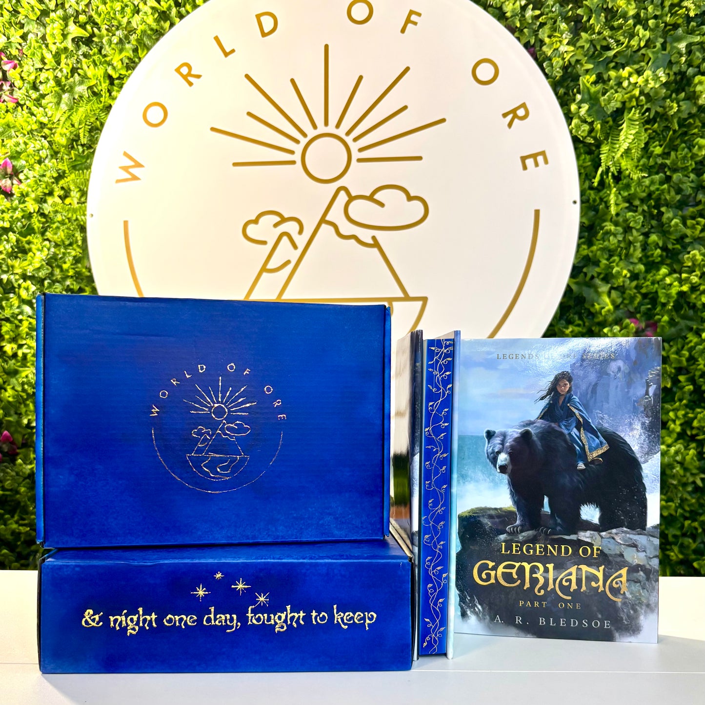 Blue book with 'World of Ose' logo and a book titled 'Legend of Geriana' on a green background