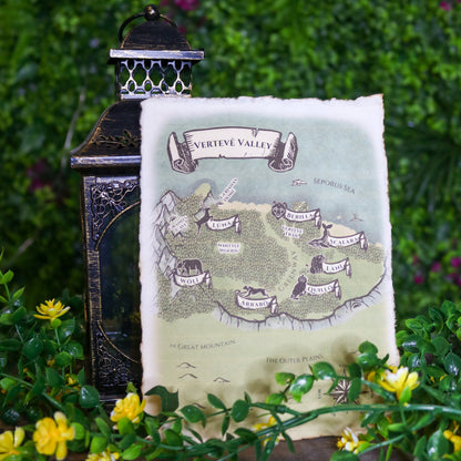 Decorative map with lantern and flowers on a wooden surface